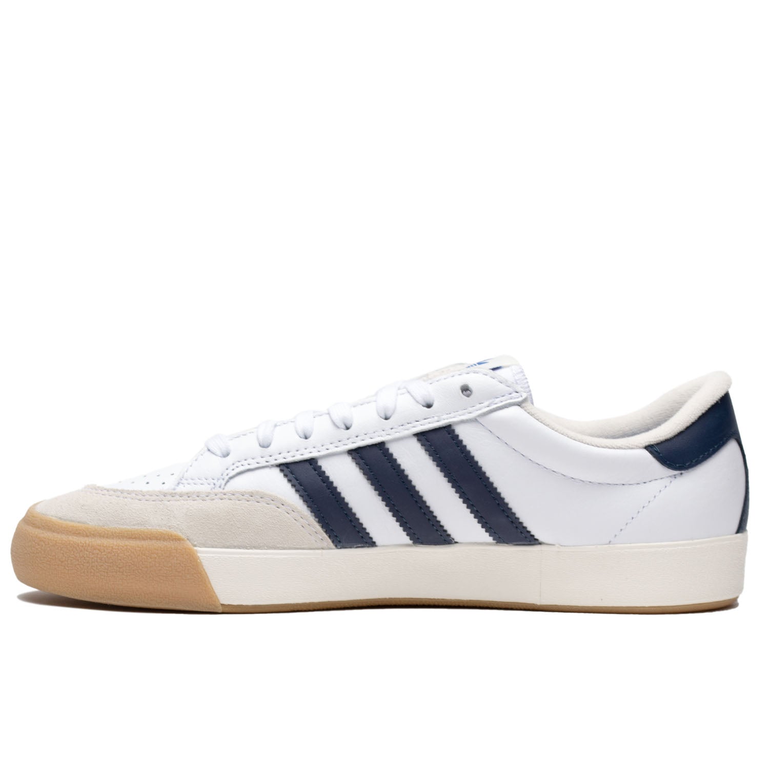 White leather Adias skateboarding shoe with navy leather detailing and cream colored toe cap with white and tan rubber.