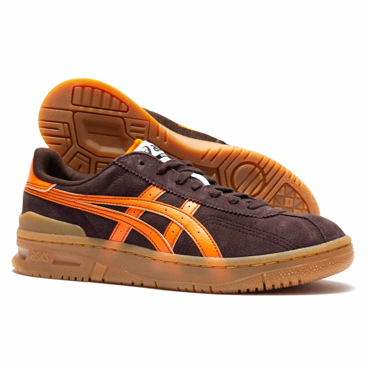 Asics Vic NBD in coffee colored brown suede. Orange leather accents on heel, and side. Orange leather Asics logo. Orange piping on white puffy tongue. Light brown slightly translucent sole.