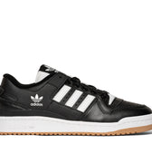 Adidas skateboarding shoe black leather with white stripes, two layered sole with white on top and gum below