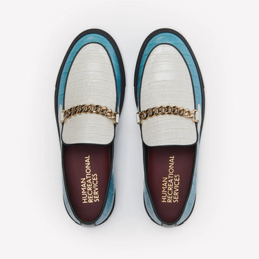 Humean recreational services el dorado loafer made with light blue and white croc leather and gold cuban link chain with black sole. 