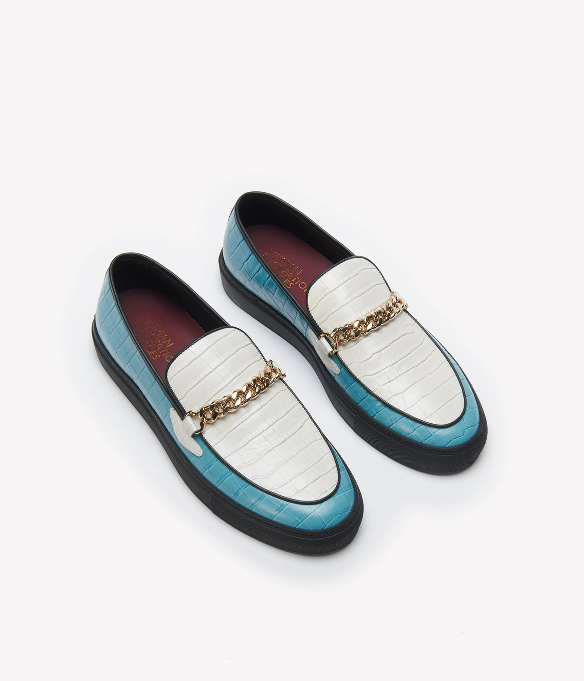 Humean recreational services el dorado loafer made with light blue and white croc leather and gold cuban link chain with black sole. 