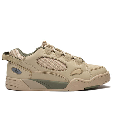 The Es Muska in tan and green, endorsed by Chad Muska, is the pinnacle of skateboarding footwear. Its PU cage and heel mesh offer durability, while the rubber toe cap and lace protection ensure longevity. Features like the hidden stash pocket, heel pull tab, and reflective logo on the heel add convenience and style. With a molded EVA footbed and 400 NBS rubber cupsole, it provides comfort and grip, ideal for skaters of all levels.