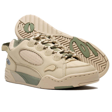 The Es Muska in tan and green, endorsed by Chad Muska, is the pinnacle of skateboarding footwear. Its PU cage and heel mesh offer durability, while the rubber toe cap and lace protection ensure longevity. Features like the hidden stash pocket, heel pull tab, and reflective logo on the heel add convenience and style. With a molded EVA footbed and 400 NBS rubber cupsole, it provides comfort and grip, ideal for skaters of all levels.