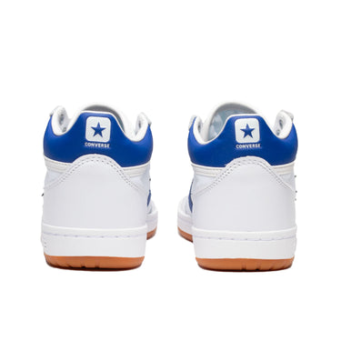 Converse Fastbreak Pro Mid: Retro style meets durability. White sneaker with royal blue accenting color and gum sole. Molded PU sockliner, mid-cut stability, and sleek design for CONS fans. Premium leather, Nylon accents, the Star Chevron logo, and rubber cupsole enhance board feel.