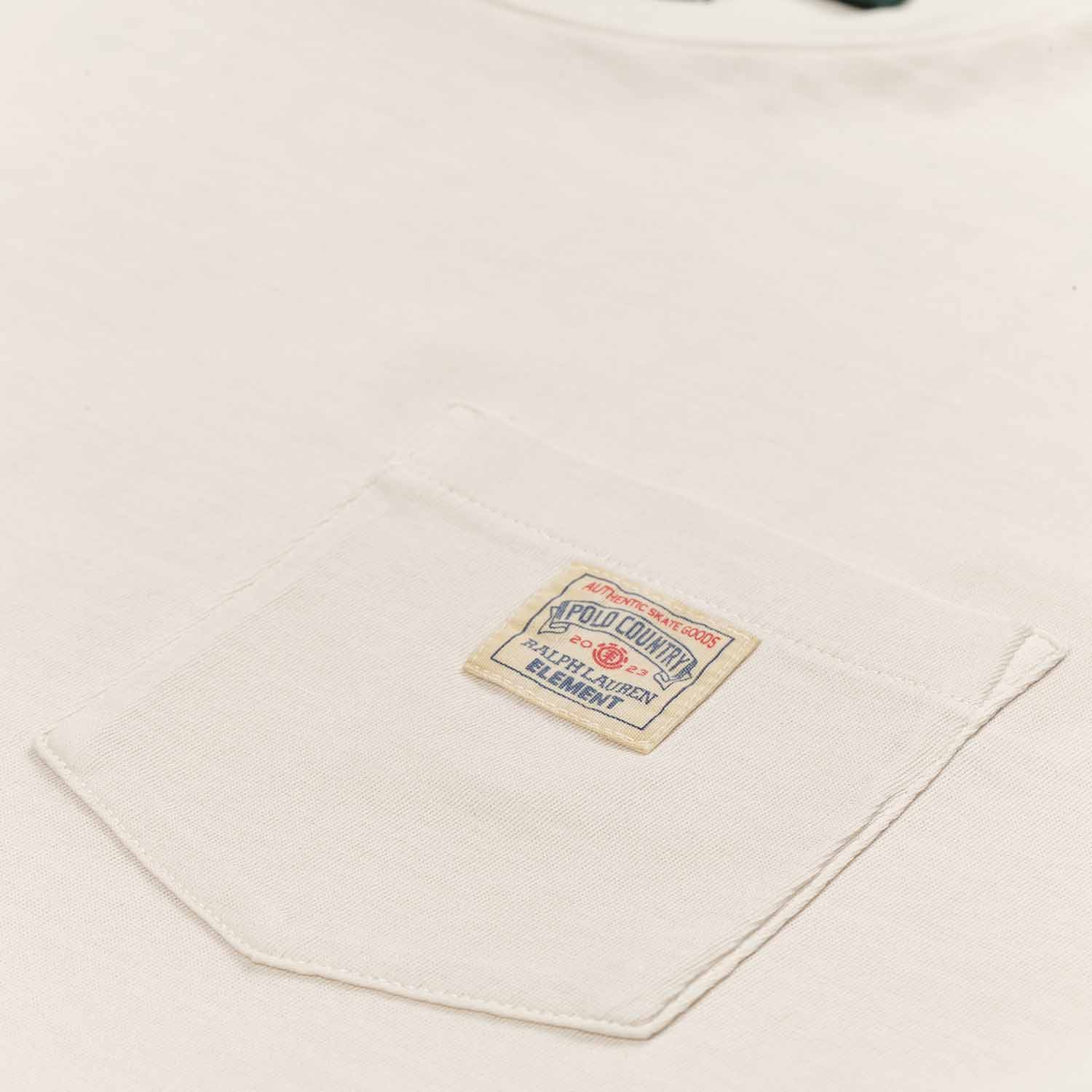 Polo Ralph Lauren x Element Pocket Tee in cream. Small front pocket on left breast with small square sewn on patch. Polo Ralph Lauren x Element logo on patch in red and blue.